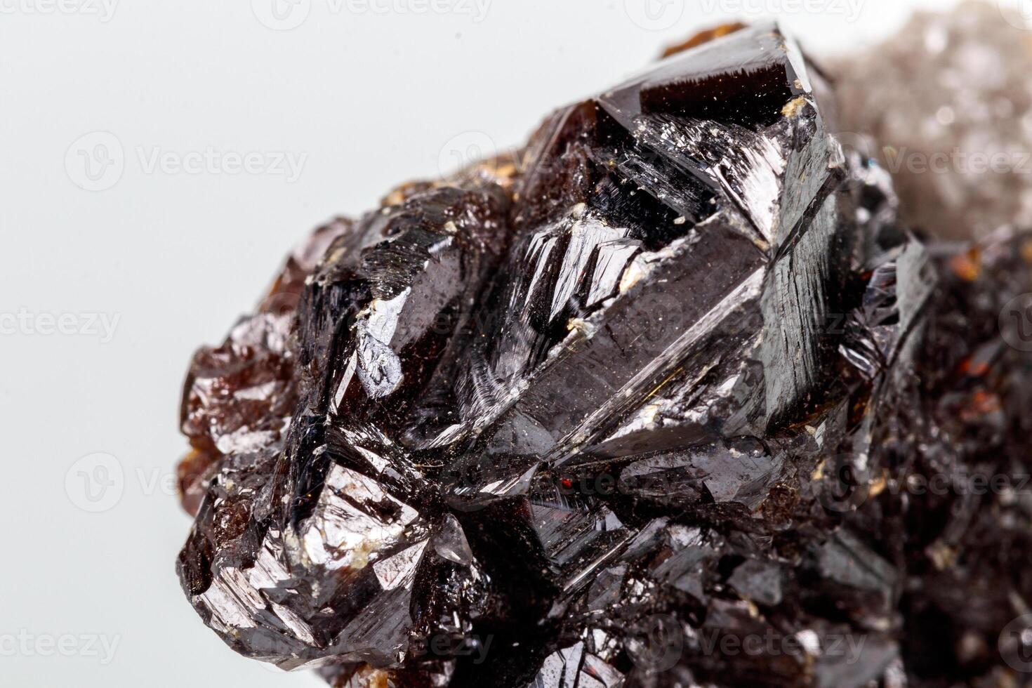 Macro of mineral Sphalerite stone on microcline on white background close up photo