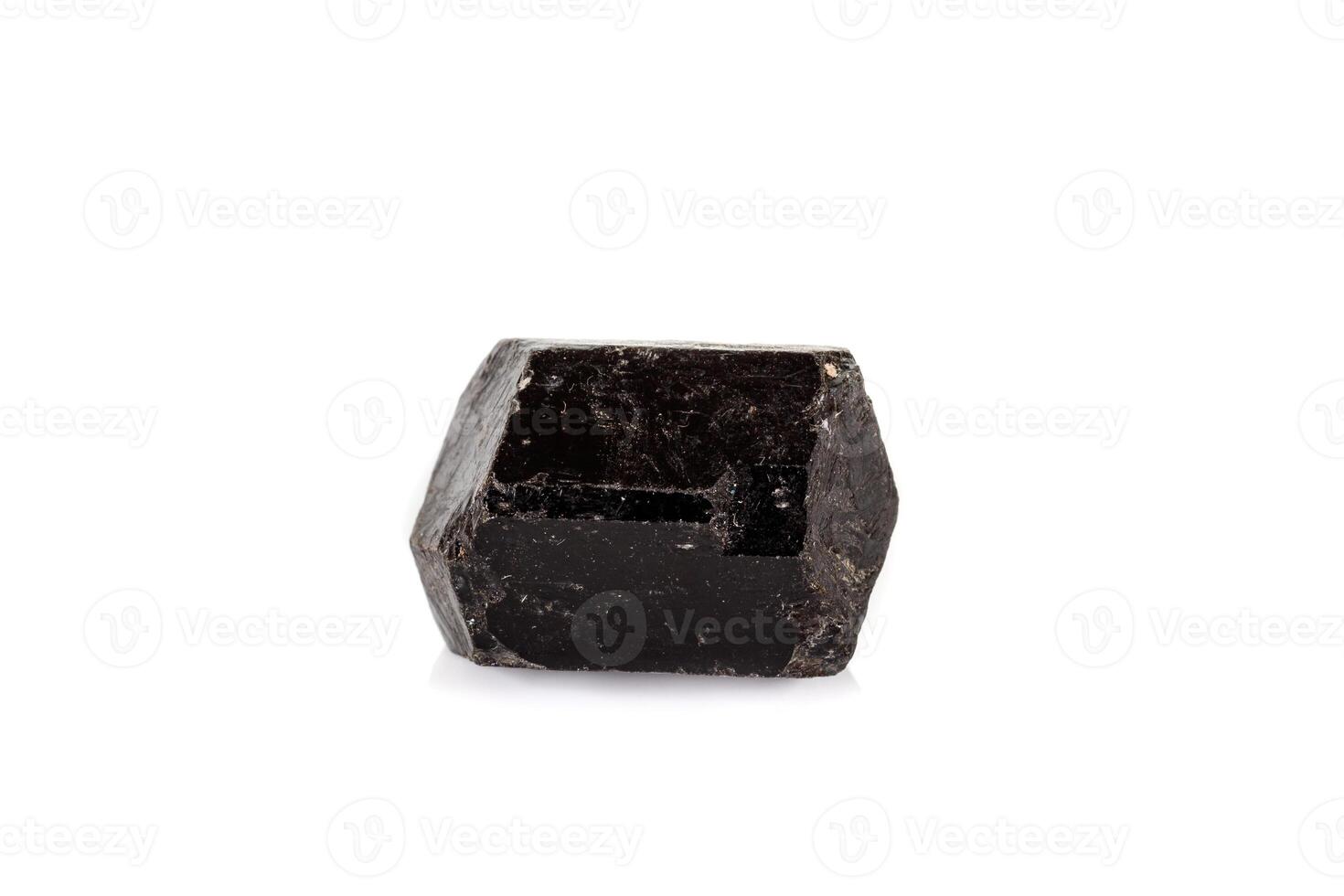macro mineral stone schorl, black tourmaline on white background close up photo