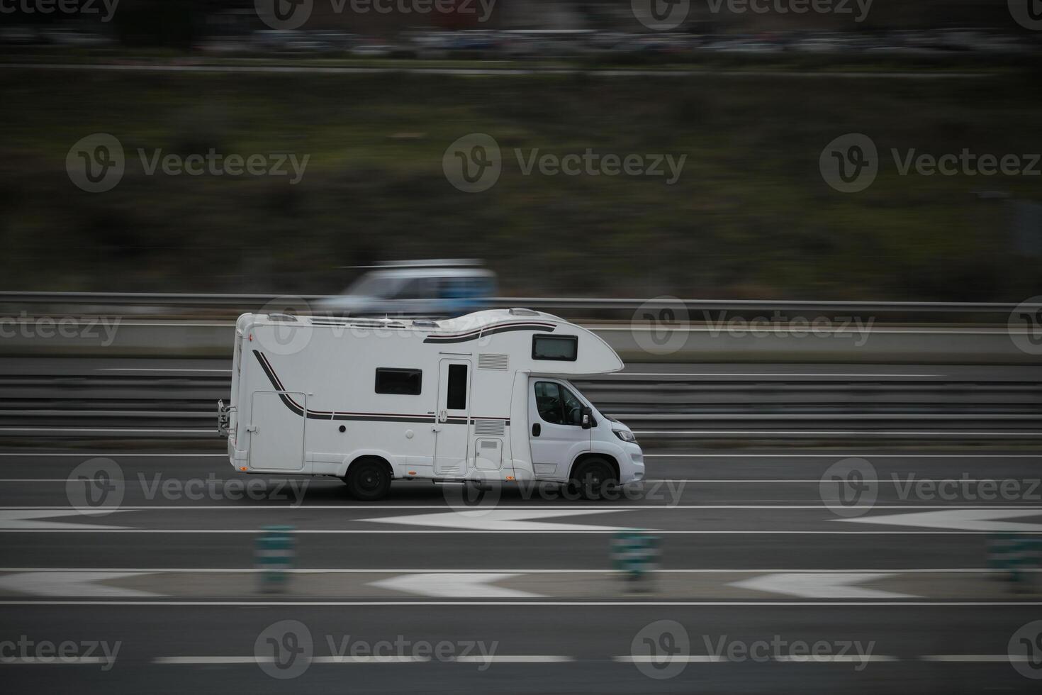 passenger car white on the highway in motion with a blurred background photo
