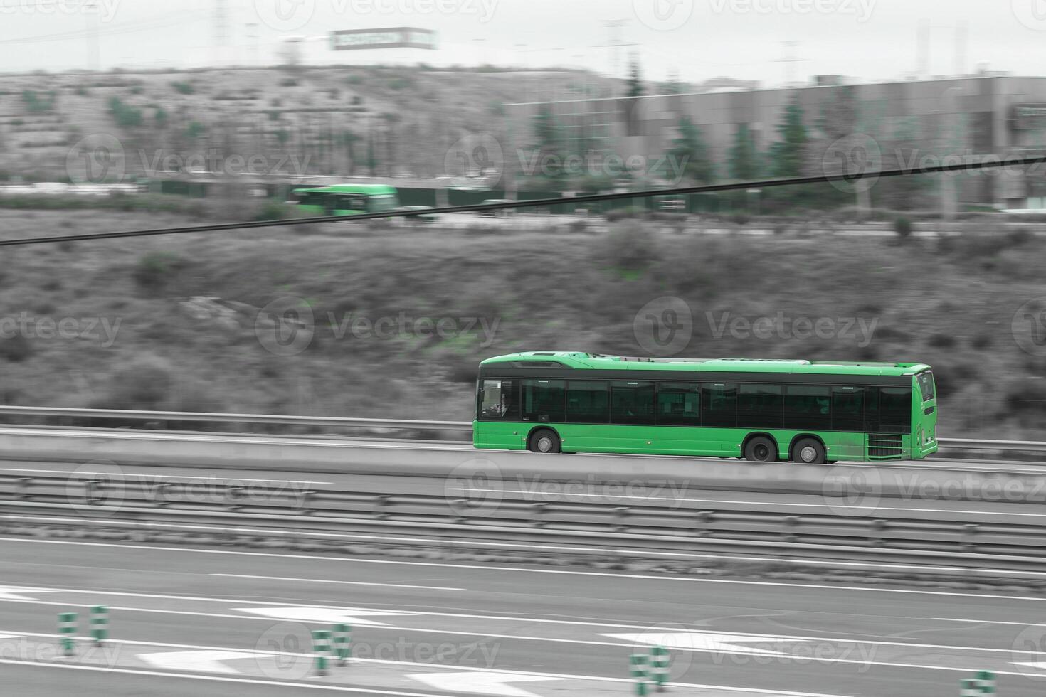green, passenger car on the highway in motion photo