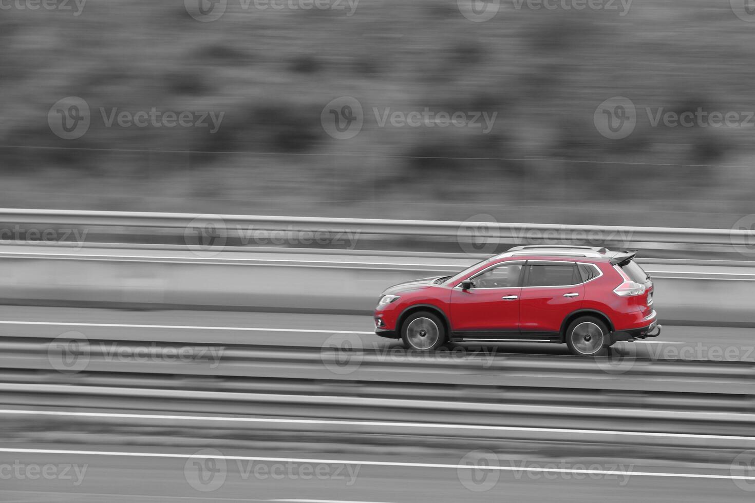 landscape passenger car on the highway in motion with a blurred background photo