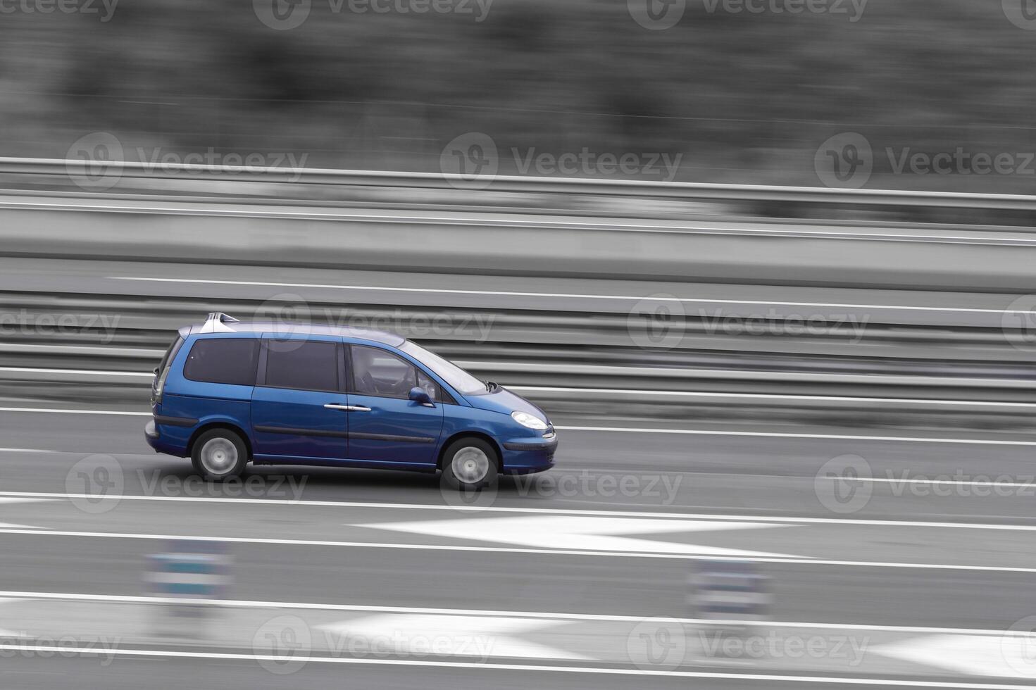 car on the highway in motion with a blurred background photo
