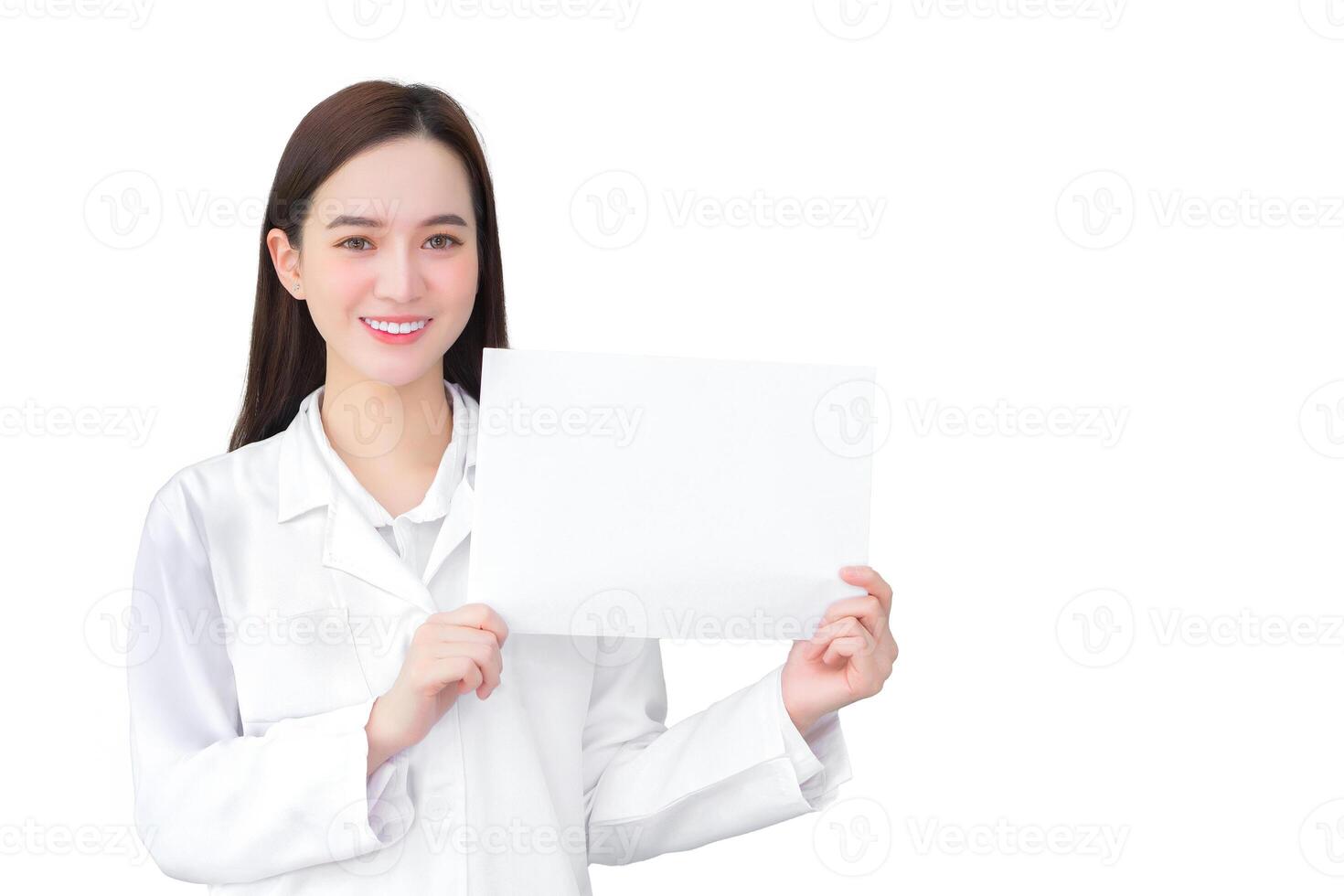 Young professional asian woman doctor who wears medical coat holds and shows white paper to present something in healthcare concept while isolated white background. photo