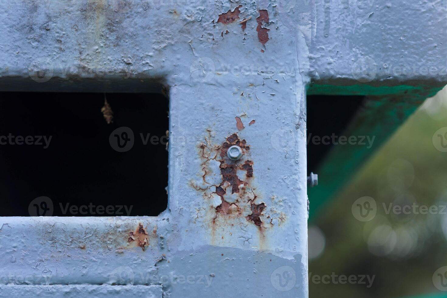 Close-up of a rusty iron door. Metal rust. Metal corrosion. Rust on old iron. photo