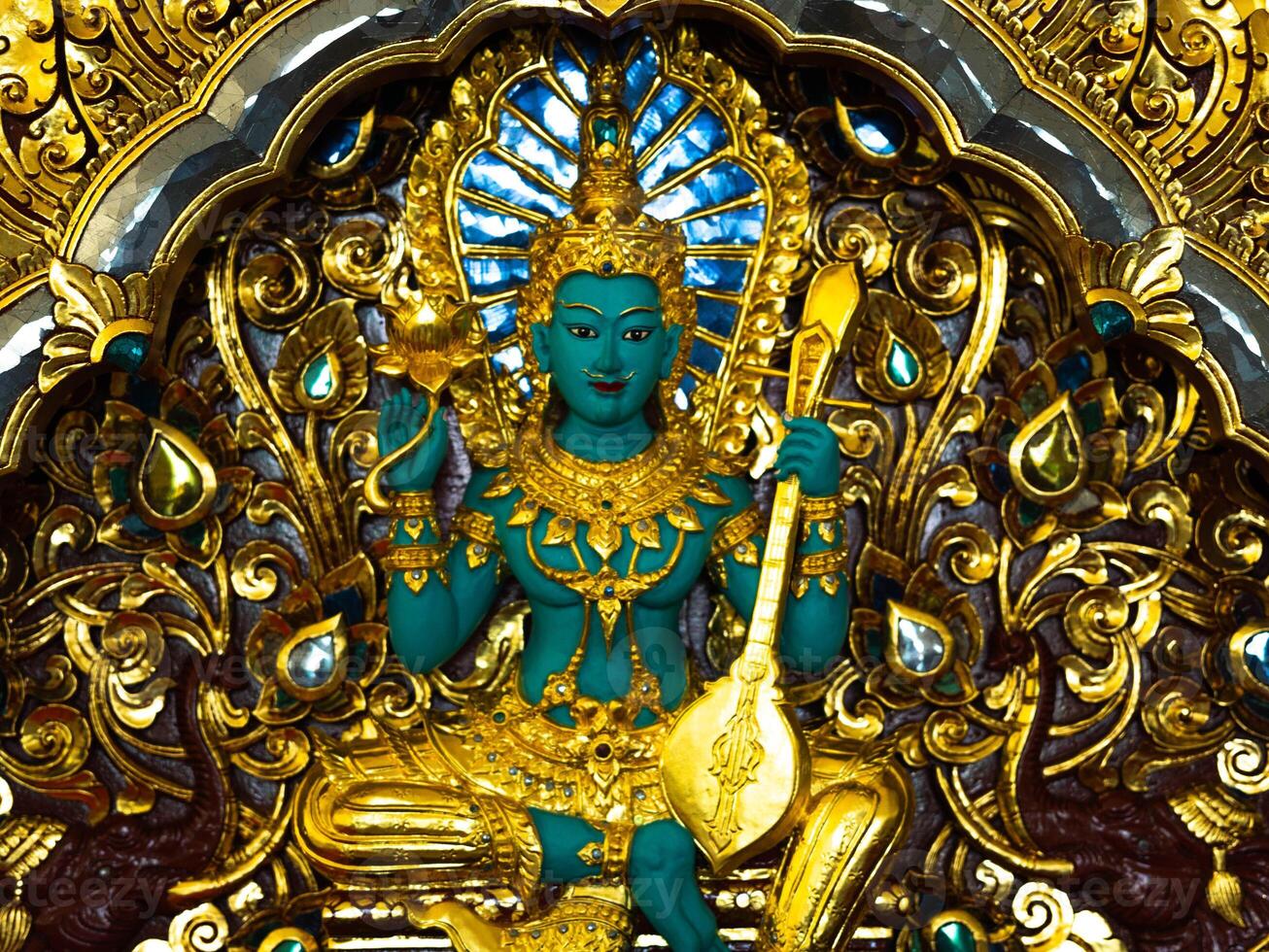 Indra statue Green giant, statues in Thai temples. Thai art in the temple. Calm and believe. photo