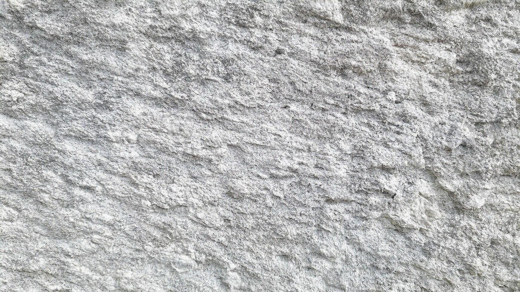 Weathered stone surface with rough textures and natural erosion, creating a realistic background for industrial and game design. photo