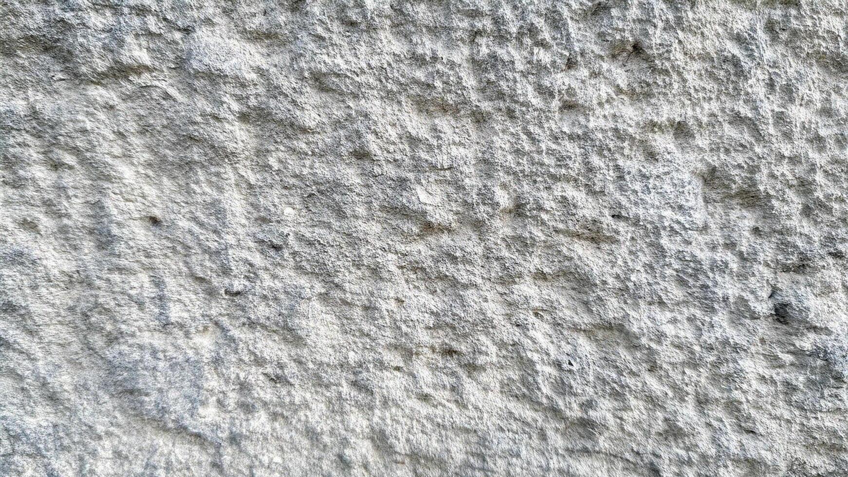 Smooth light stone surface with natural grain, ideal for minimalist, modern, and architectural design backgrounds or textures. photo