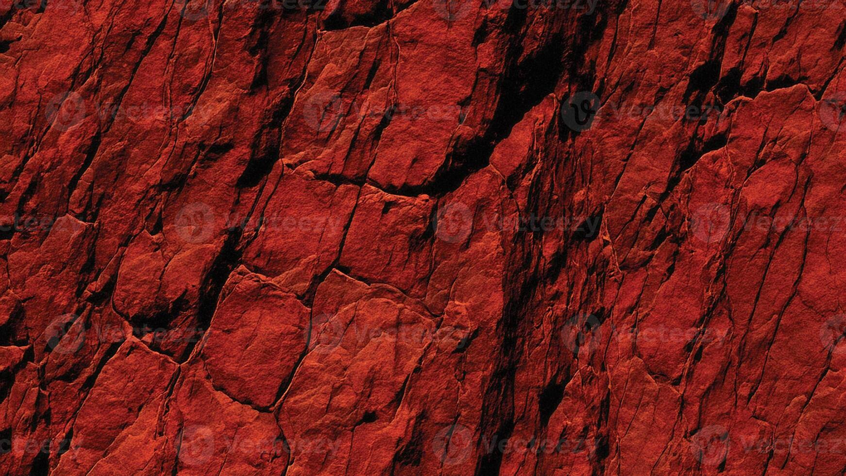 Bright red stone texture with sharp fissures and deep erosion, highlighting natural patterns perfect for design, backgrounds, and architectural inspirations. photo