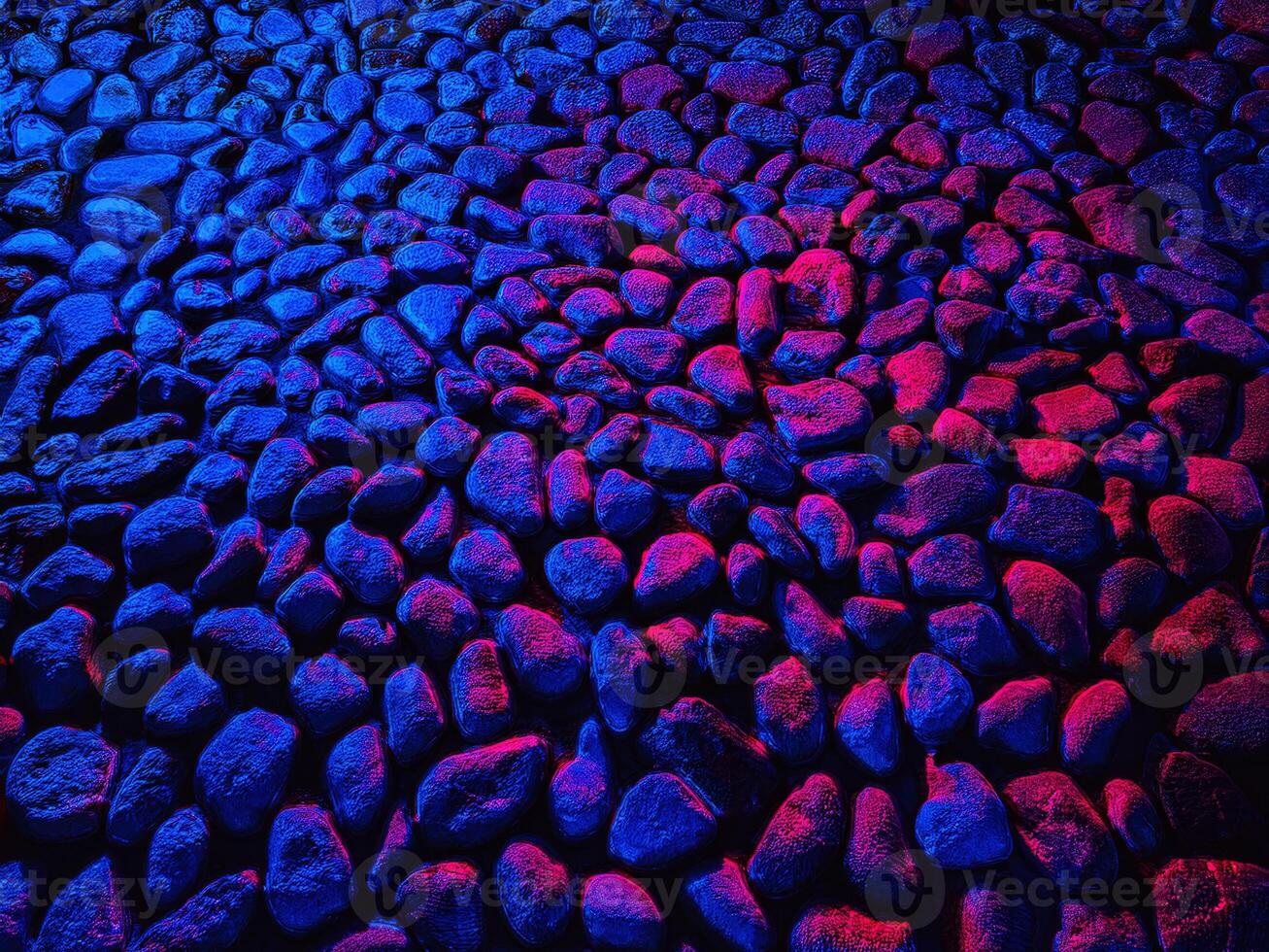 Colorful abstract texture of natural stones illuminated by vibrant lighting at night photo