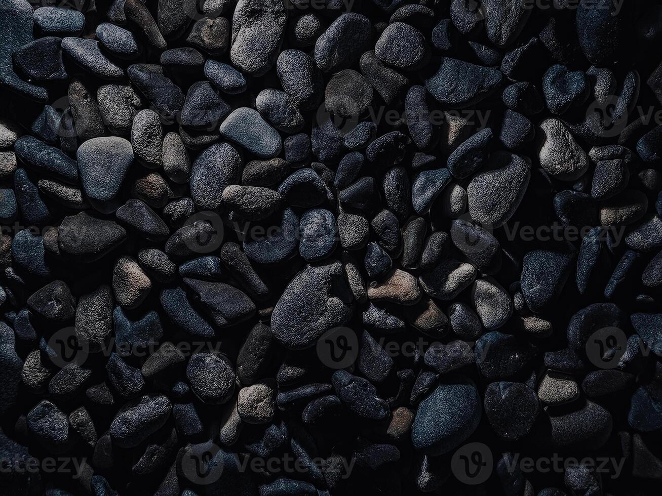 Textured dark stones create an abstract natural background for creative design and art photo