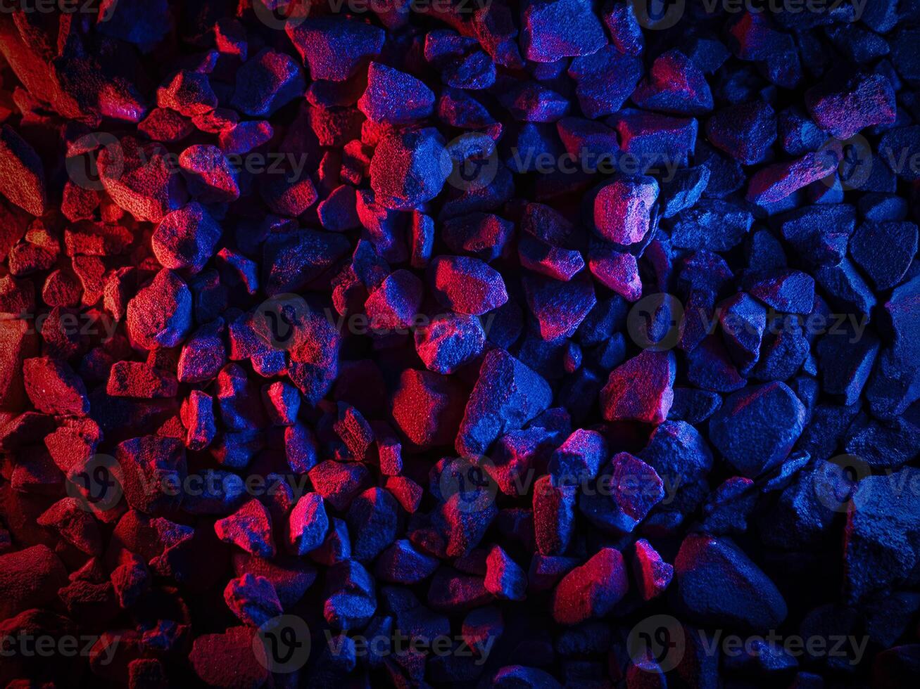 Vibrant abstract texture of natural rocks illuminated by dynamic lighting photo