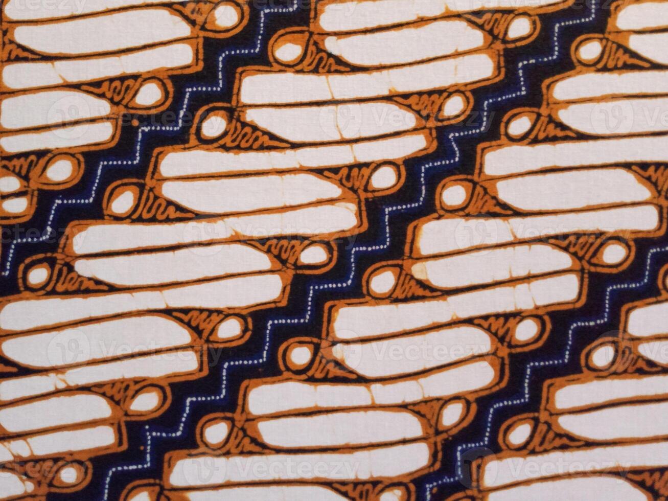 Batik pattern background. A close up of Javanese batik with a Parang Srimpi pattern. Indonesian batik. photo