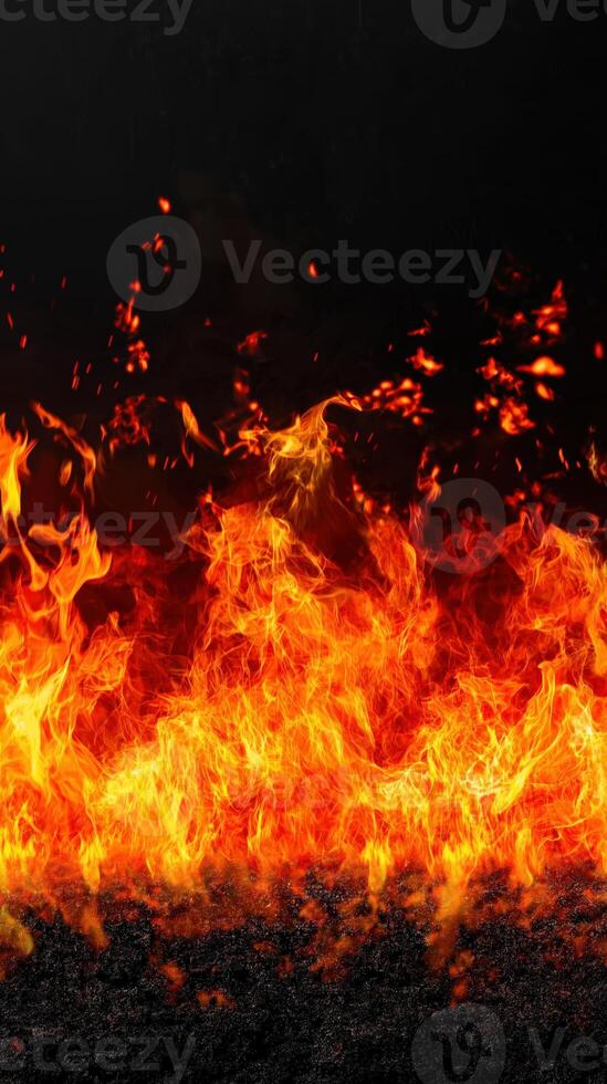 Raging fire with intense flames a black background, showcasing powerful energy photo