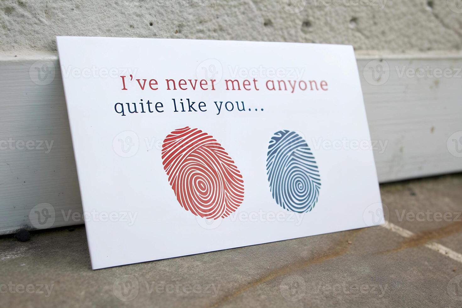 Minimalist greeting card with red and blue fingerprint patterns and romantic text. Love and identity concept photo