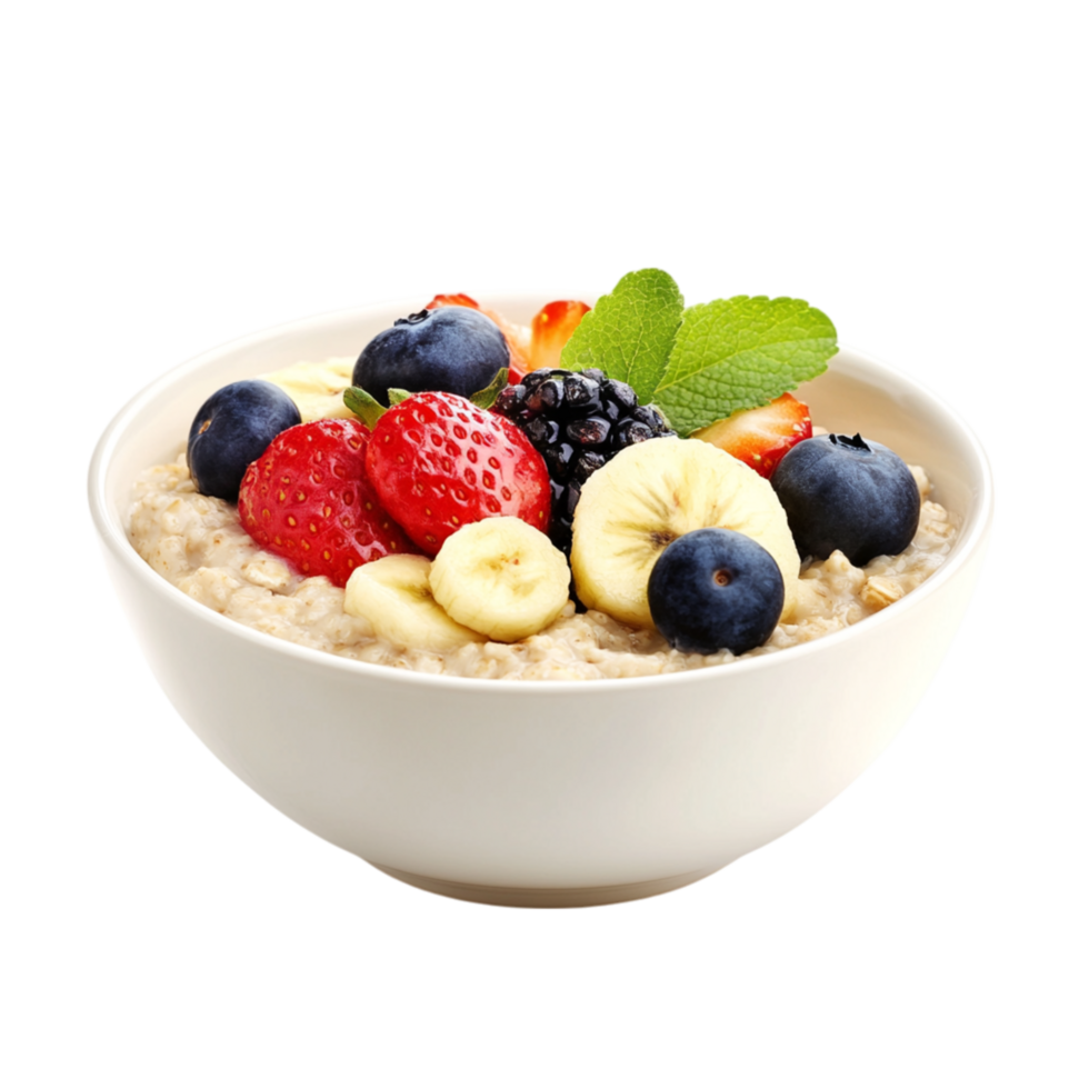 Bowl of oatmeal is decorated with banana slices blueberries raspberries and a sprig of fresh mint leaves png