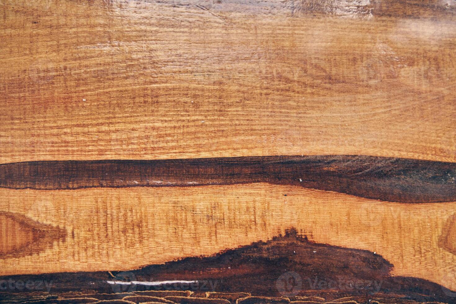 The texture of old light wood with stain and transparent epoxy resin in cracks. Beautiful modern wooden background with resin. photo