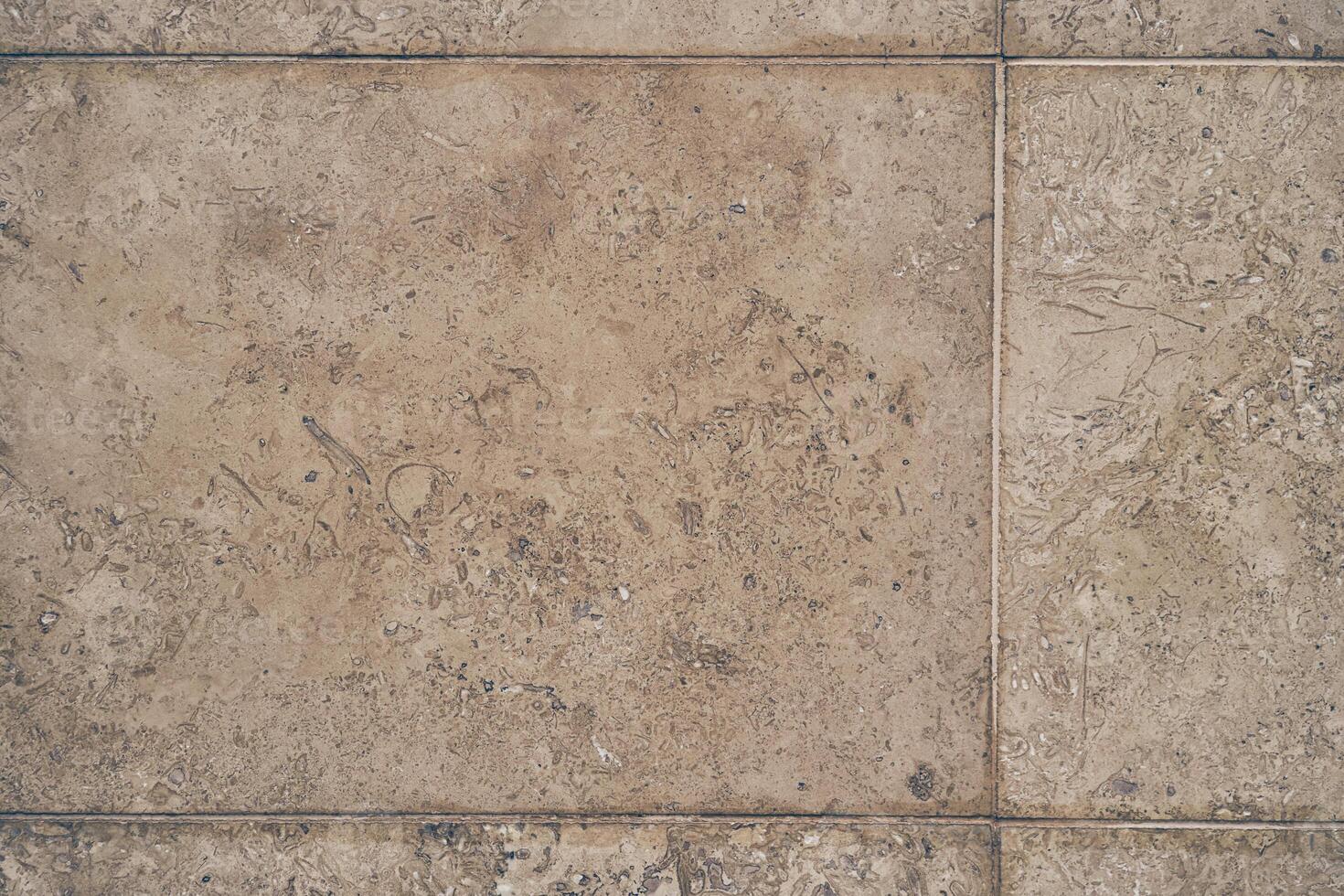 The texture of the beige stone surface. Stone tile with space to copy photo