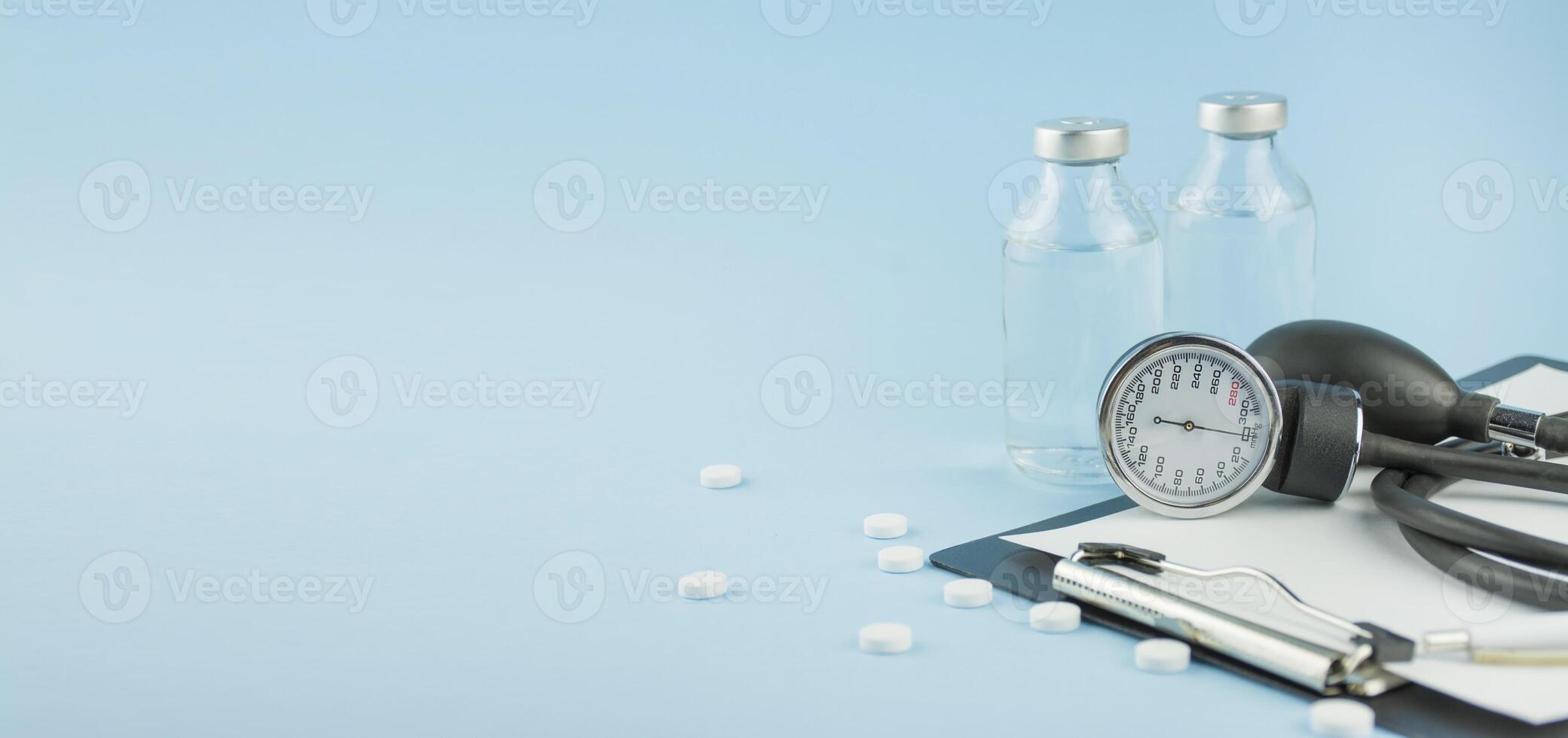 Medical device for measuring blood pressure on a blue background. Medical education. The medicine. Copy space. Banner. photo