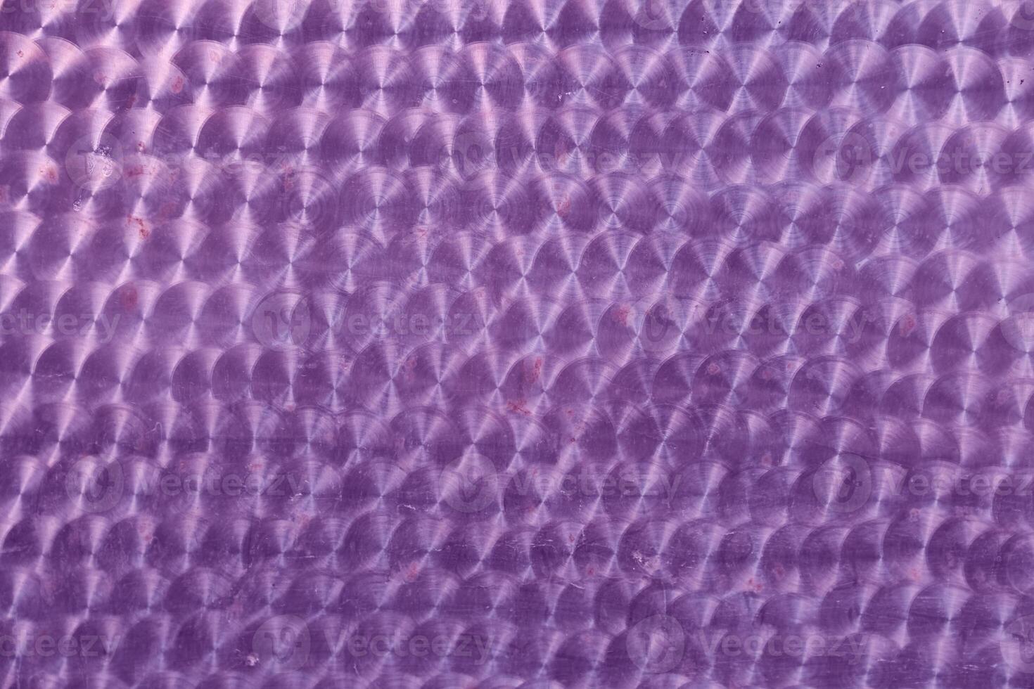 A holographic surface of lilac color with space for copying. Iridescent film texture photo
