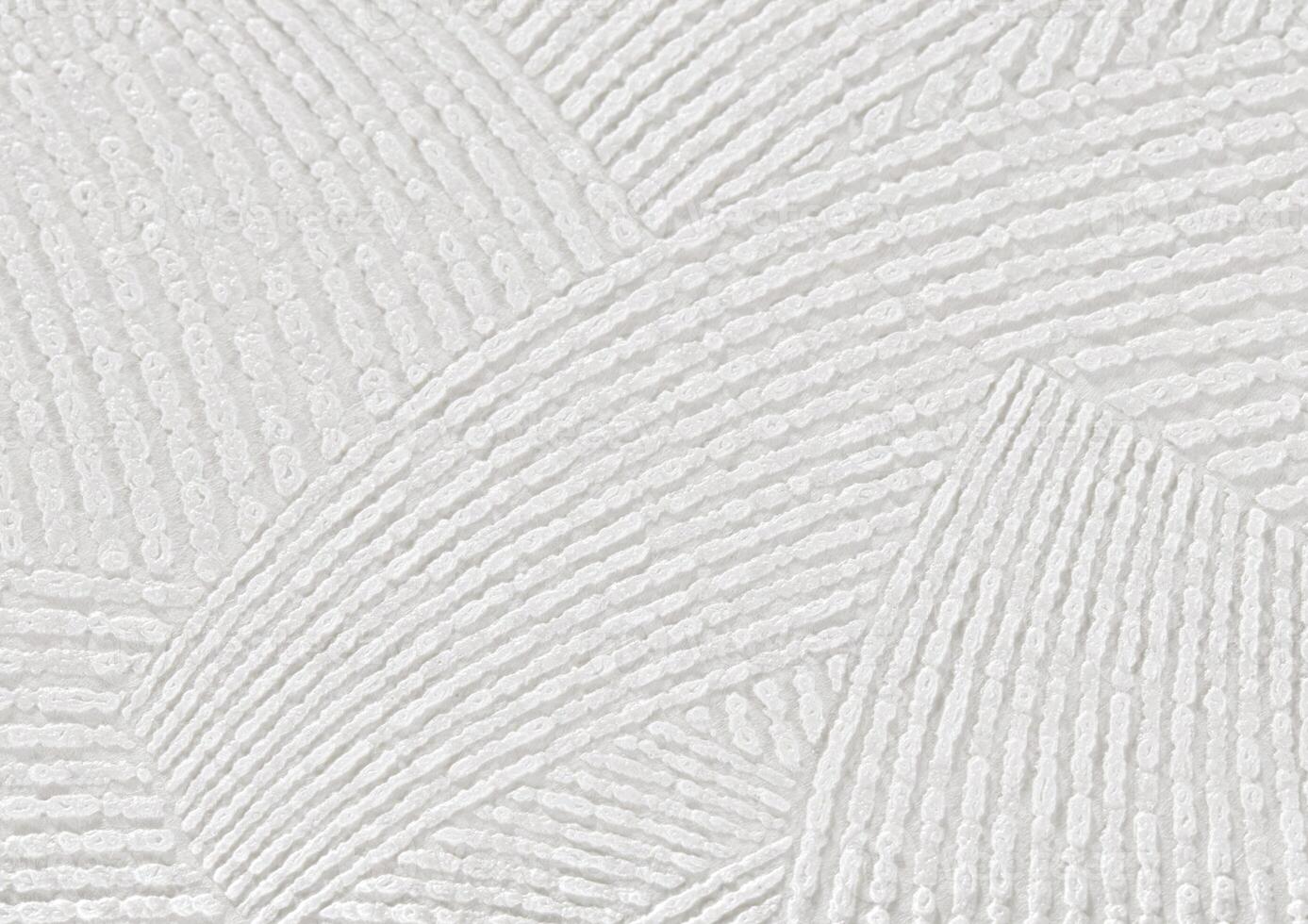 A background of white evenly textured paper wallpaper with large, even strokes. photo