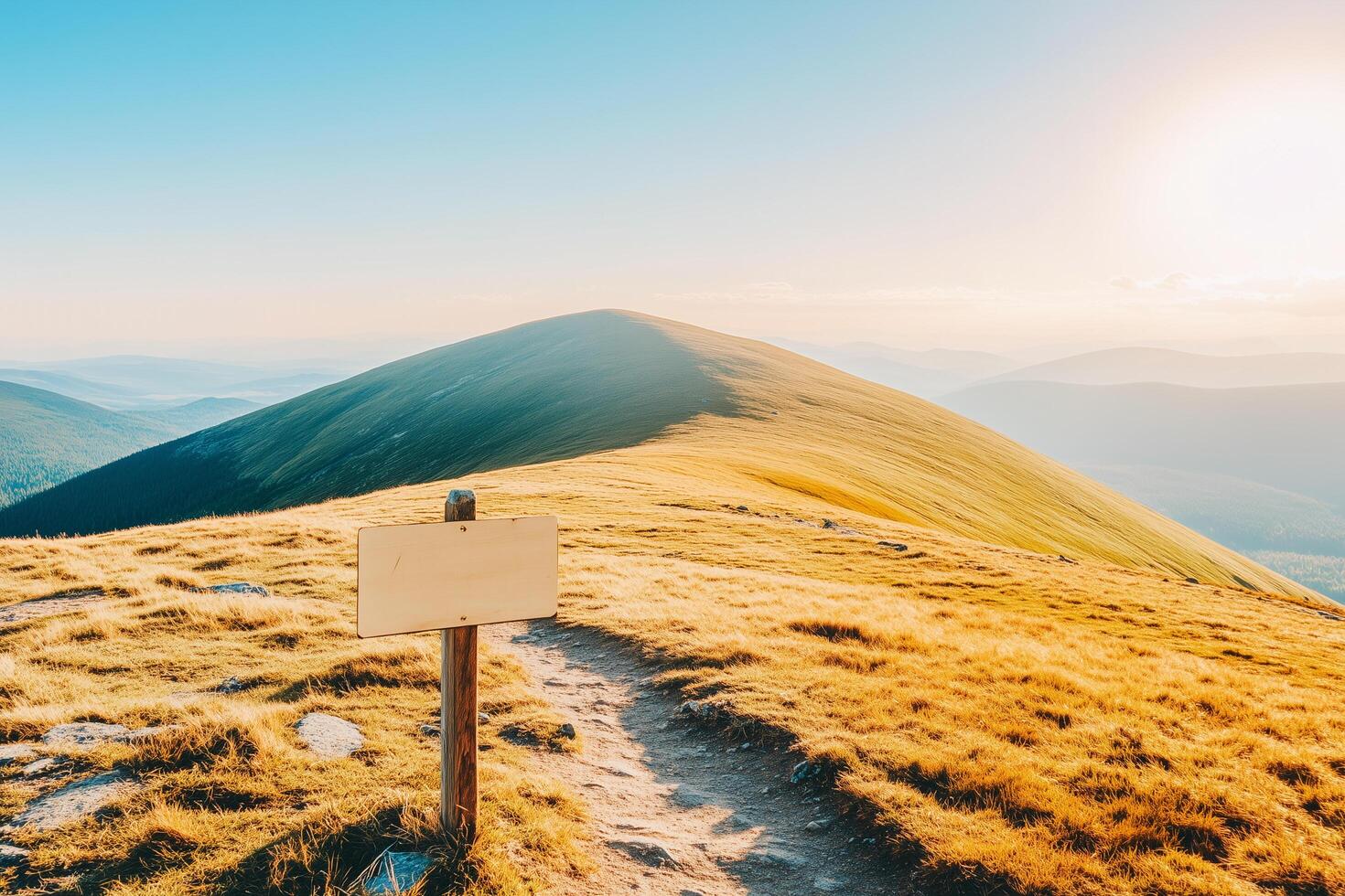 Scenic Mountain Landscape at Sunset with Empty Wooden Sign on Trail in Serenity photo