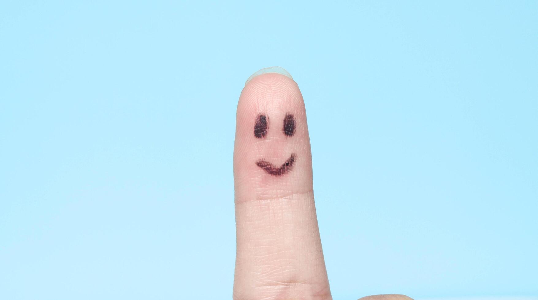 fingers with happy faces like family or friends, fingers with smiling emojis, fingers with faces photo