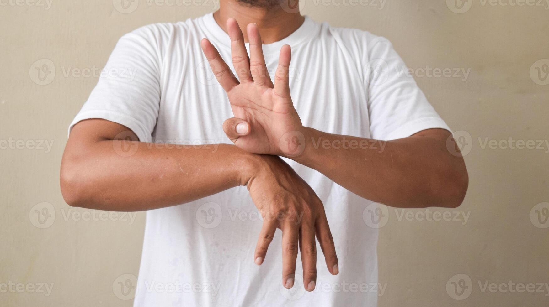 young man showing sign language with hand gestures speaking body language photo