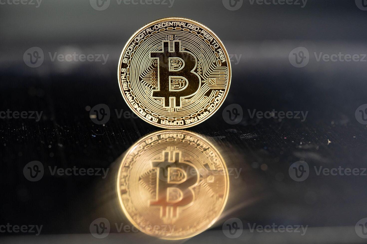 bitcoin on a mirroring background photo