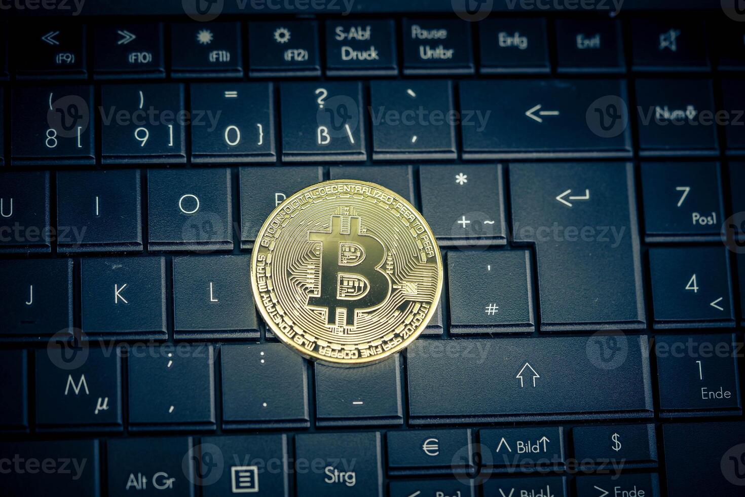 Bitcoin on a computer keyboard photo
