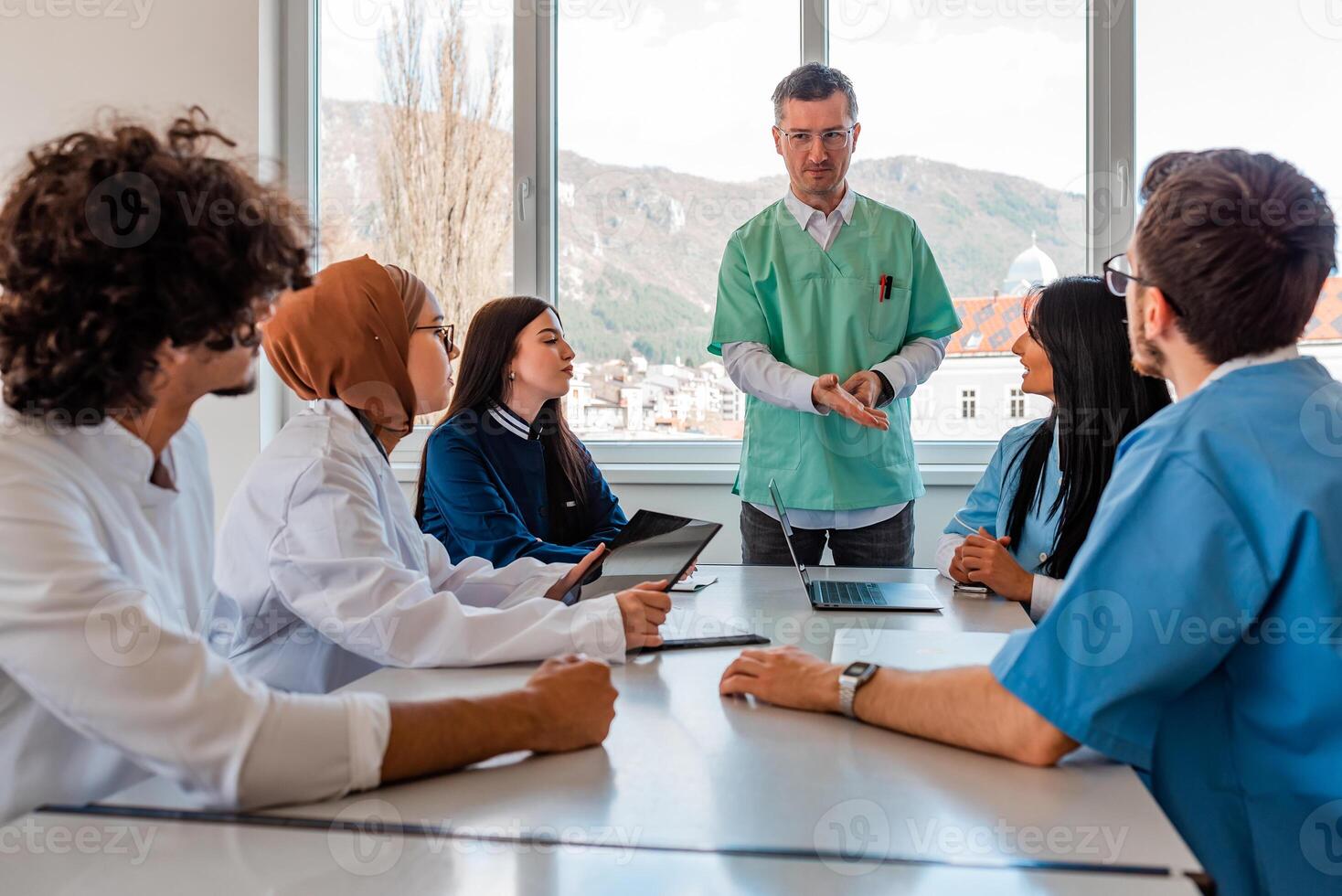 Medical team interacting at a meeting in conference room. photo