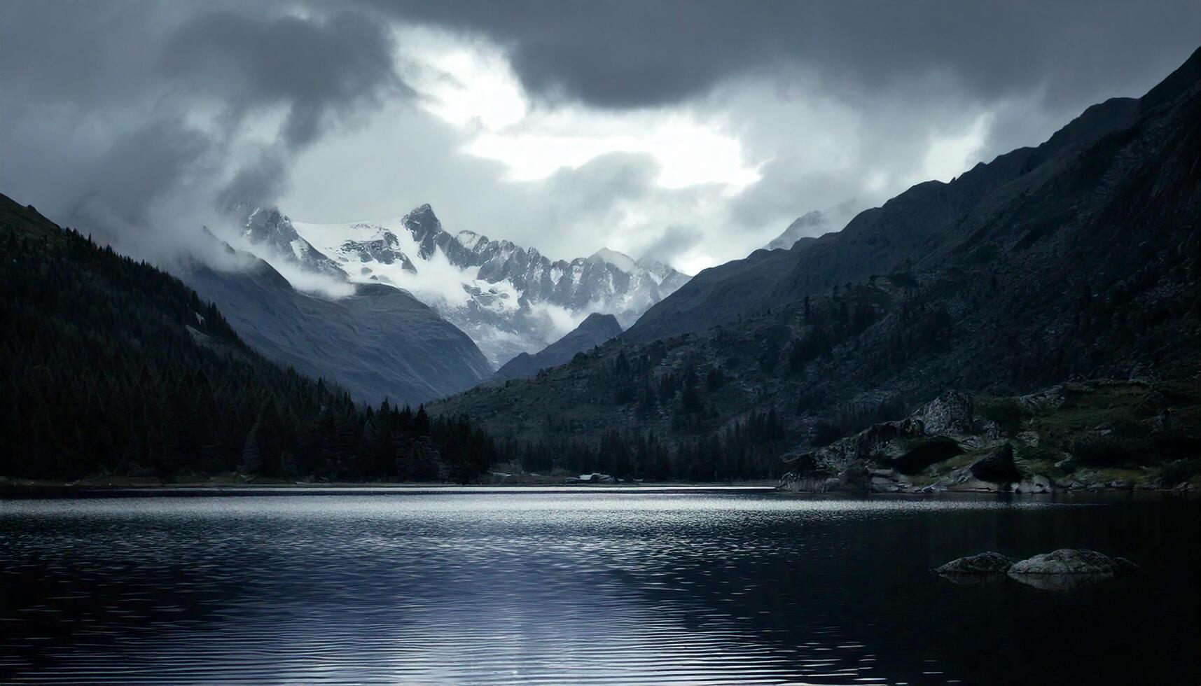 Cinematic dark foggy-capped mountains photo