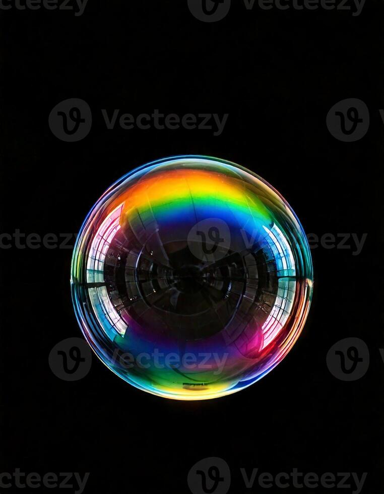 Single bubble with rainbow reflection in a black background photo