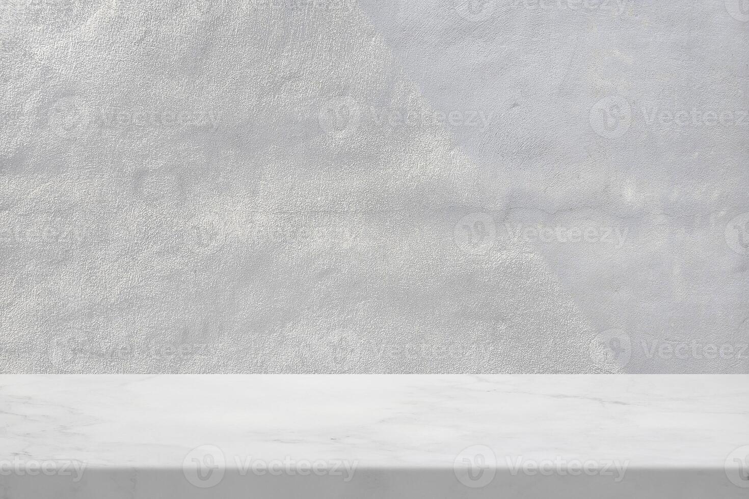 Marble Table with White Cement Wall Texture Background with Light Beam and Shadow photo