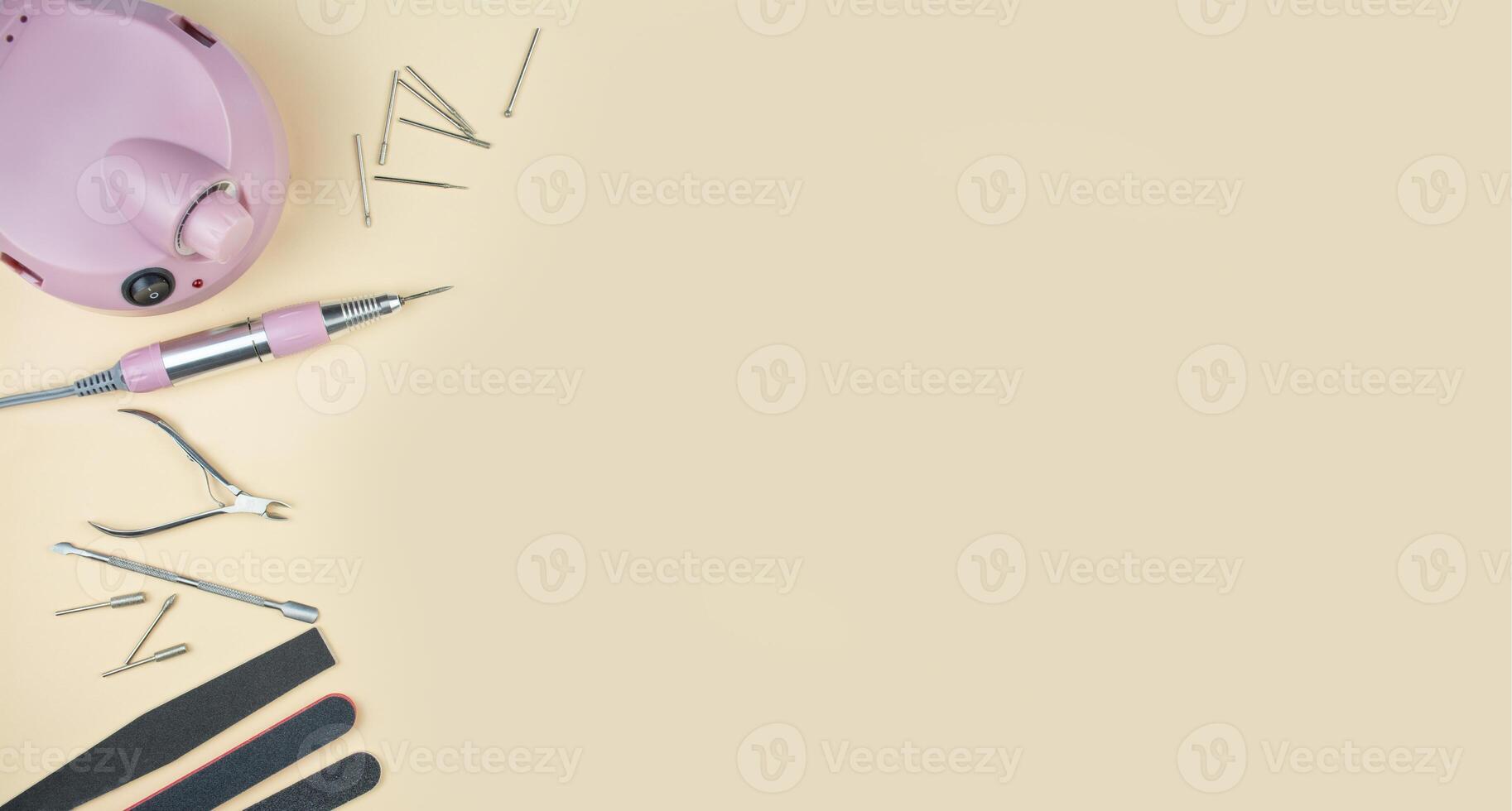 Set of manicure tools and accessories on a light background. Hardware manicure. Nail care . Flat lay. Banner. photo