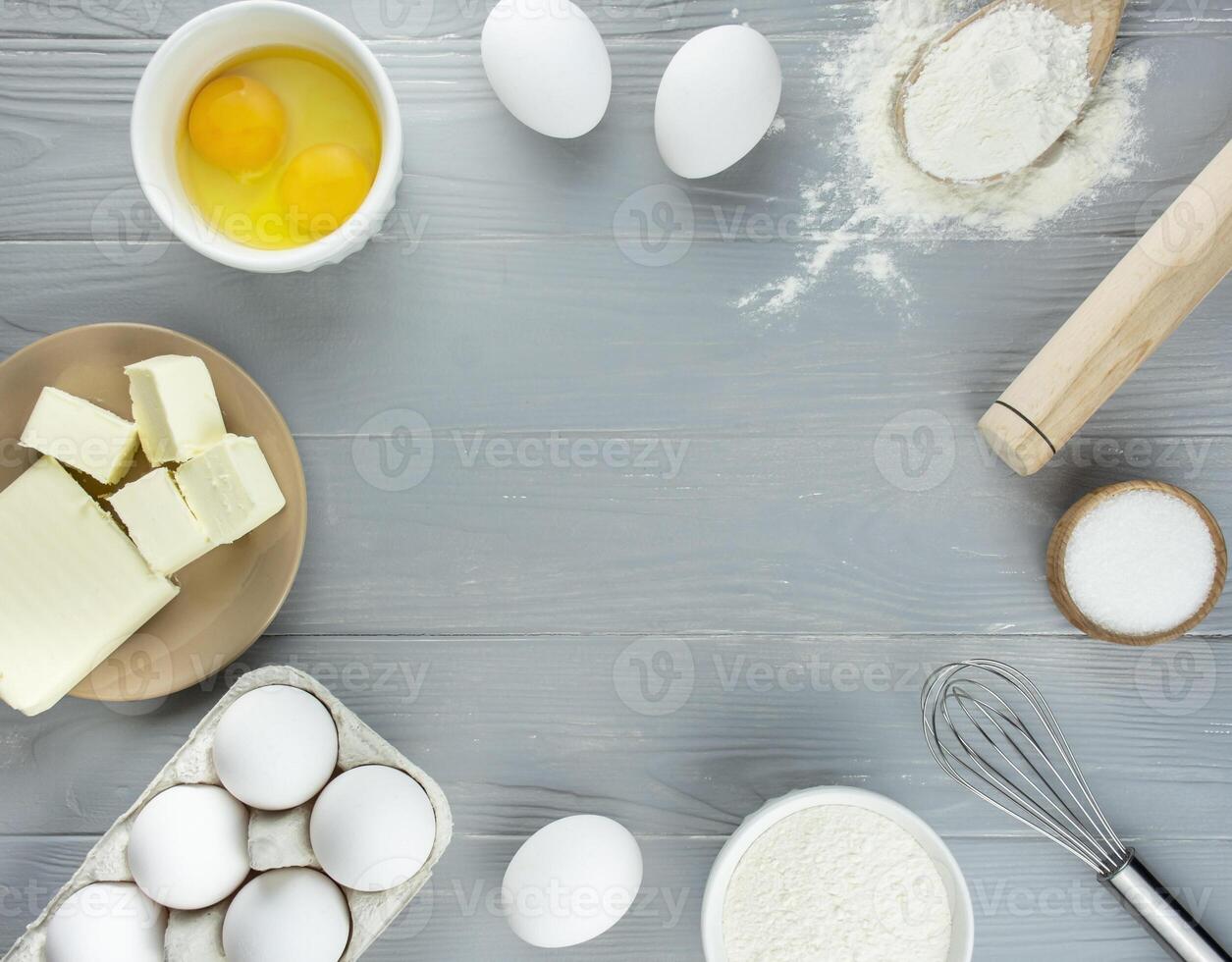 Ingredients and kitchen utensils for making homemade cakes photo