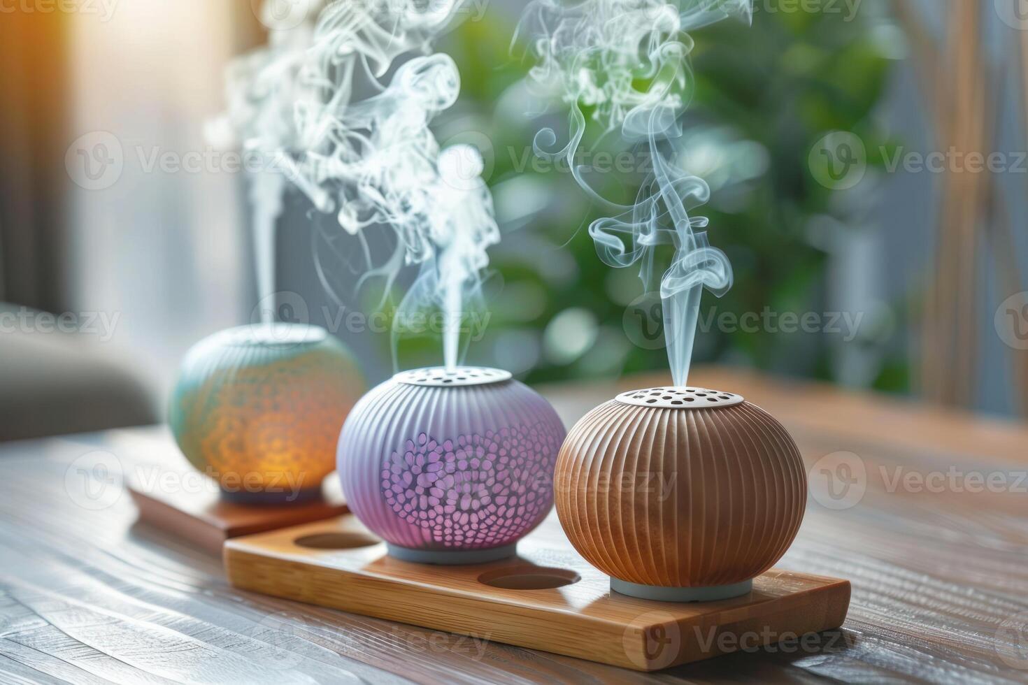 Three aroma diffusers releasing soothing scents in a tranquil home environment photo