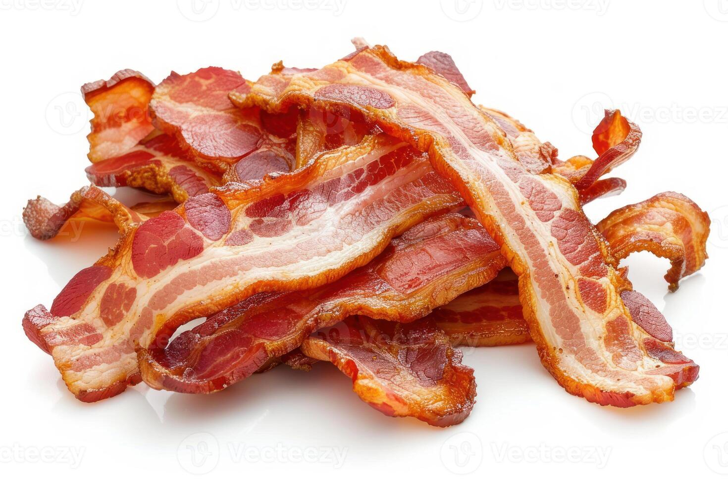 Delicious crispy bacon rashers piled up on white background photo