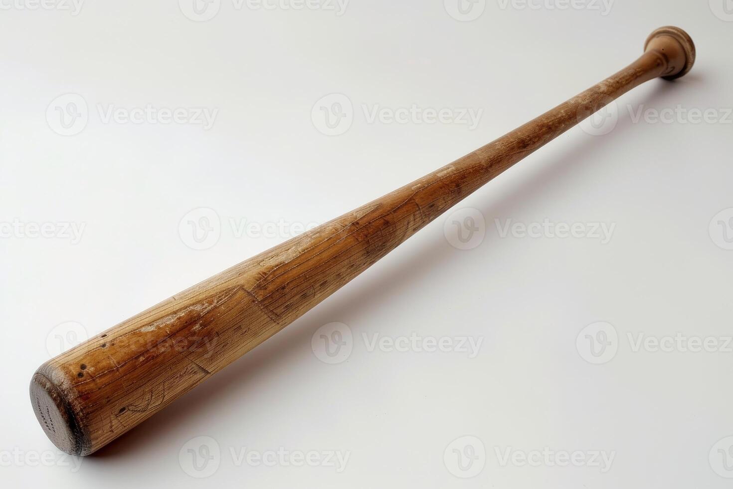 Old baseball bat isolated on white background showing wood grain photo
