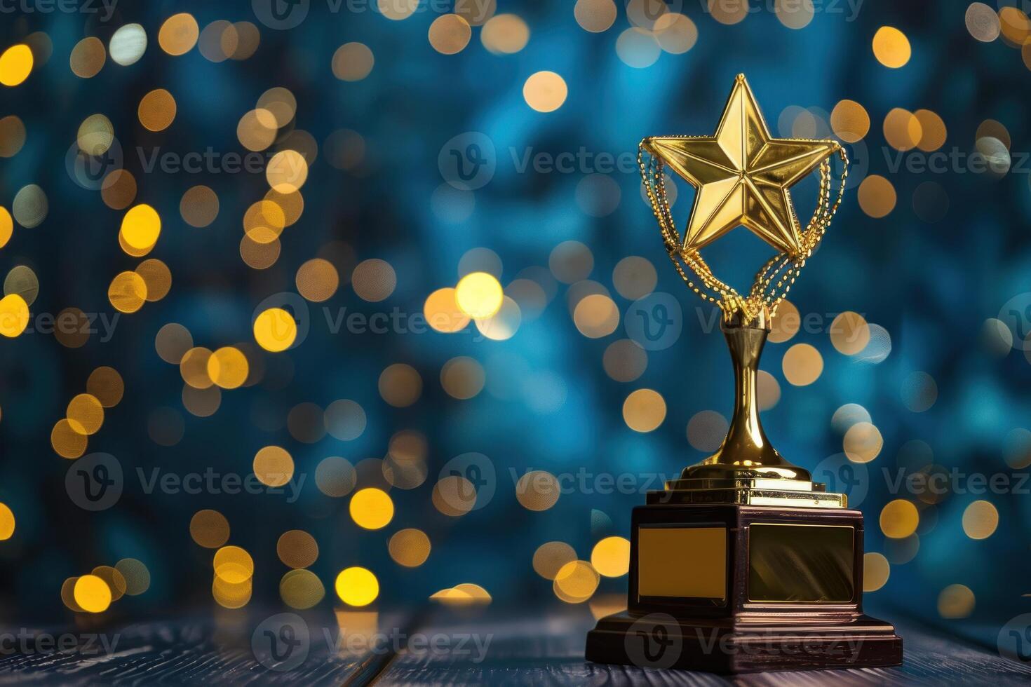 Golden trophy with star standing on wooden surface and glowing background photo