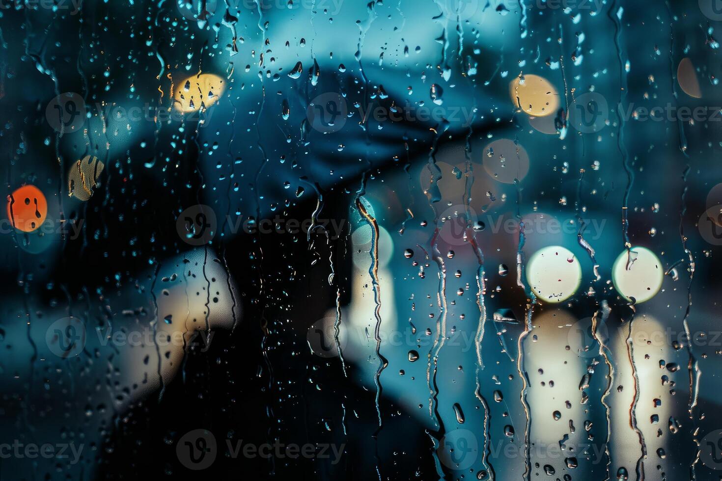 Person with umbrella walking on street in rain with bokeh lights photo