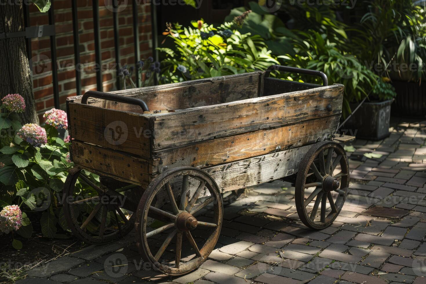 Old wooden cart resting on brick pathway in lush garden photo