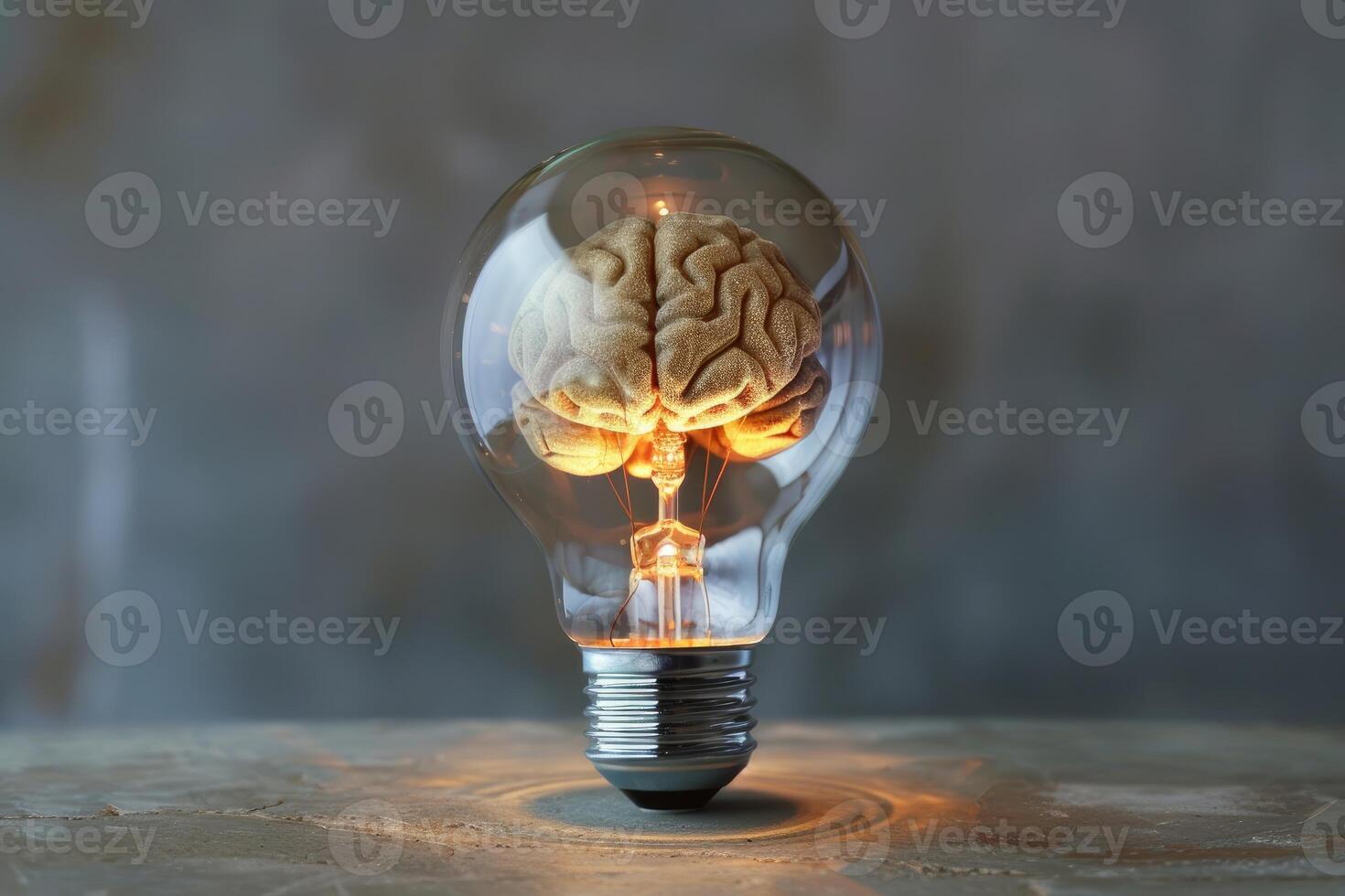 Glowing light bulb containing brain symbolizing ideas and innovation photo