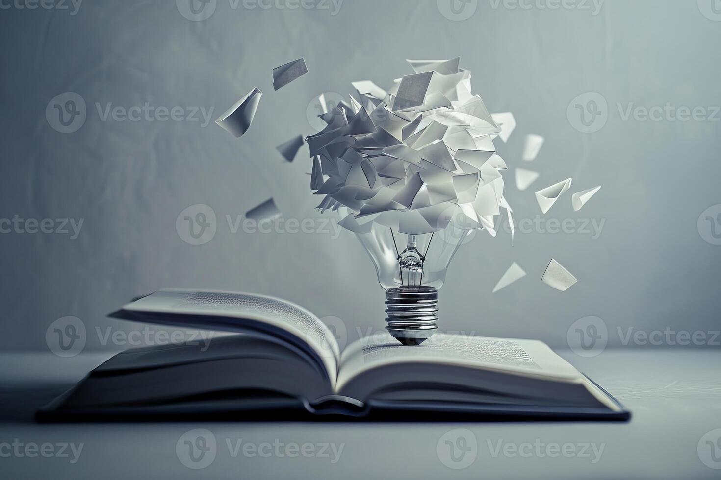 Crumpled paper exploding from light bulb balancing on open book symbolizing ideas photo