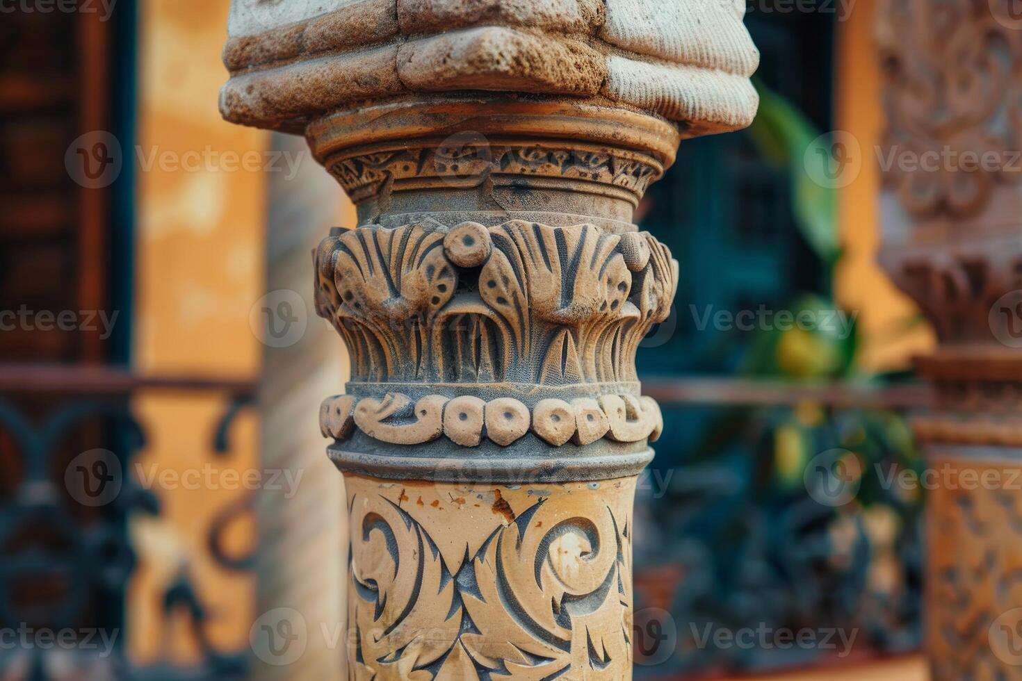 Close up of ornate stone column showing intricate carvings and textures photo