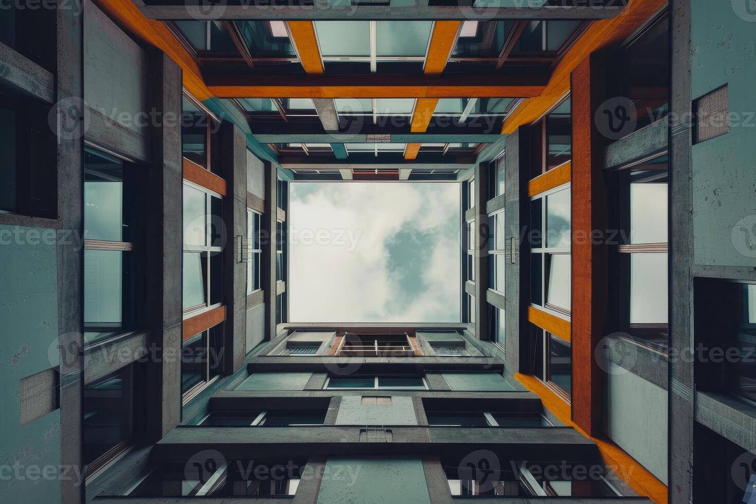 Modern building with colorful facade and cloudy sky above photo