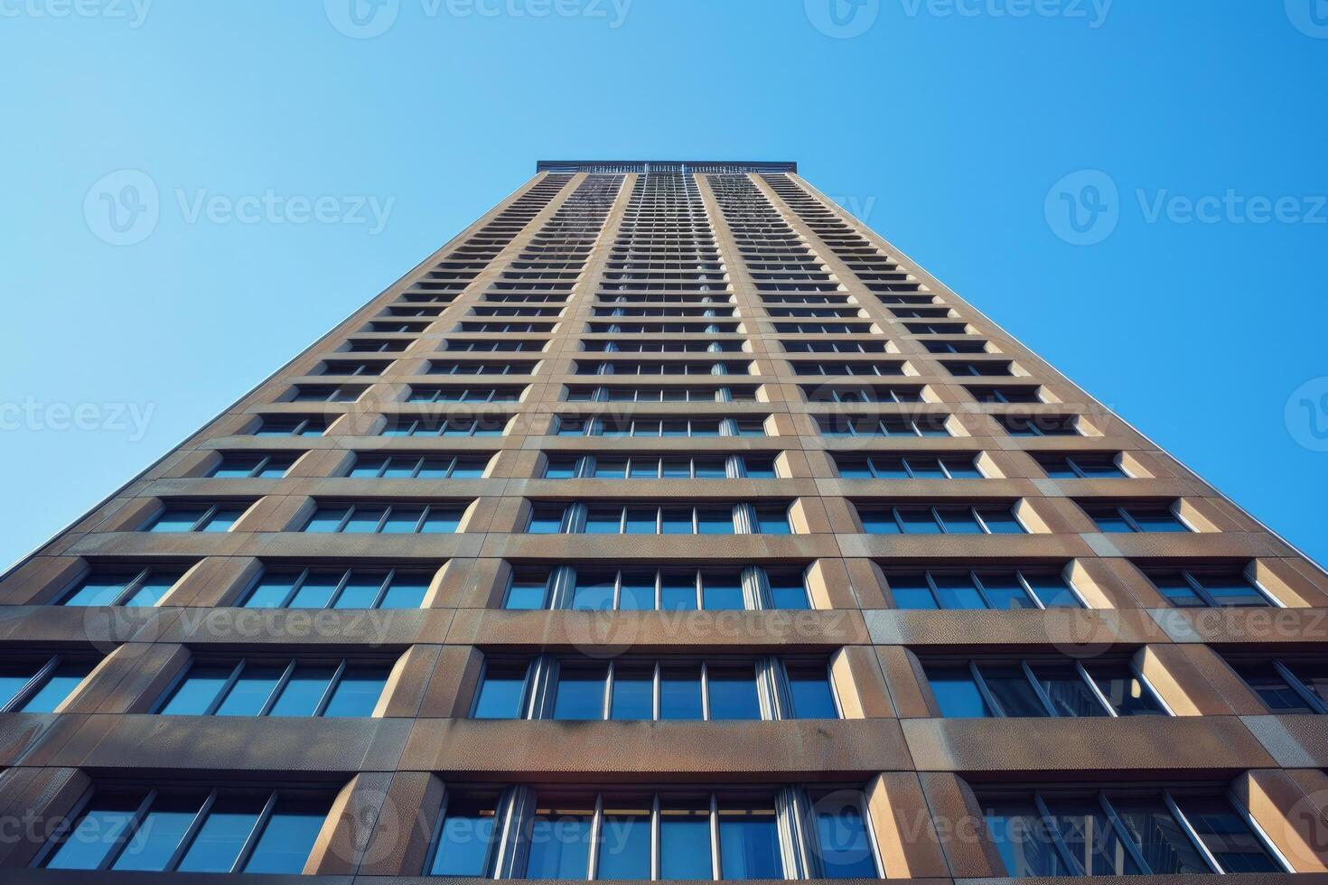 Modern office building reaching for the sky on a sunny day photo