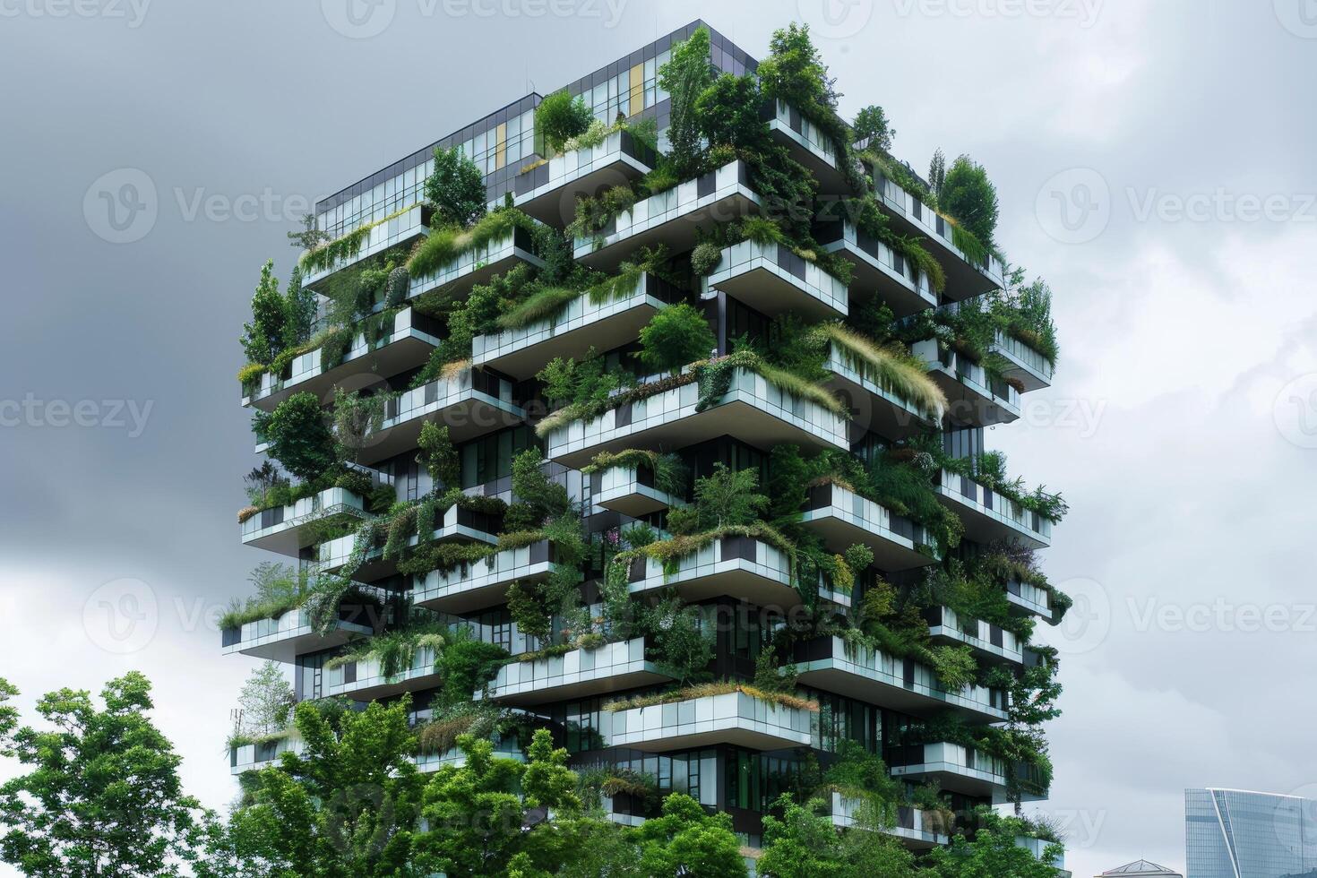 Modern green building showing sustainable architecture with plants growing on balconies photo