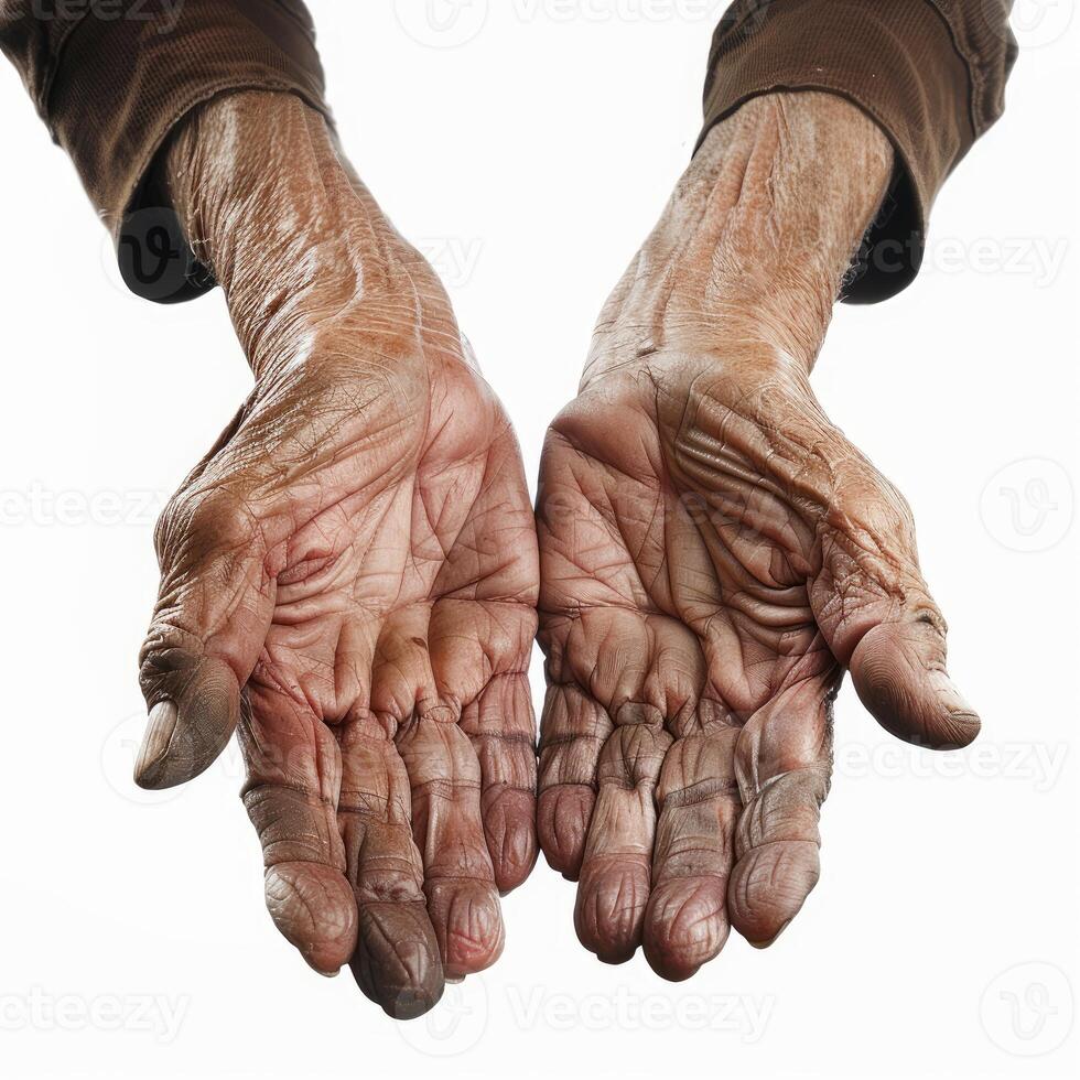 Senior man showing his dirty working hands palms up photo