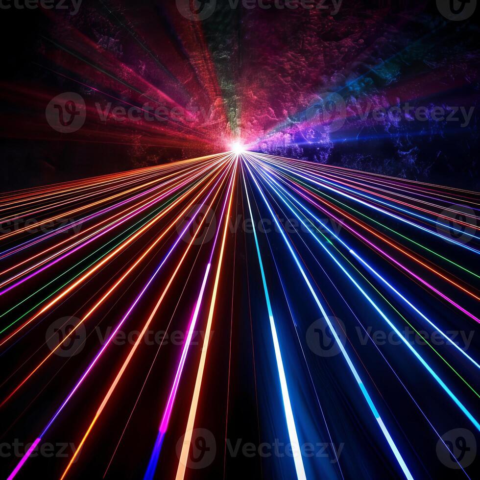Colorful light trails converging on bright light source against dark background photo
