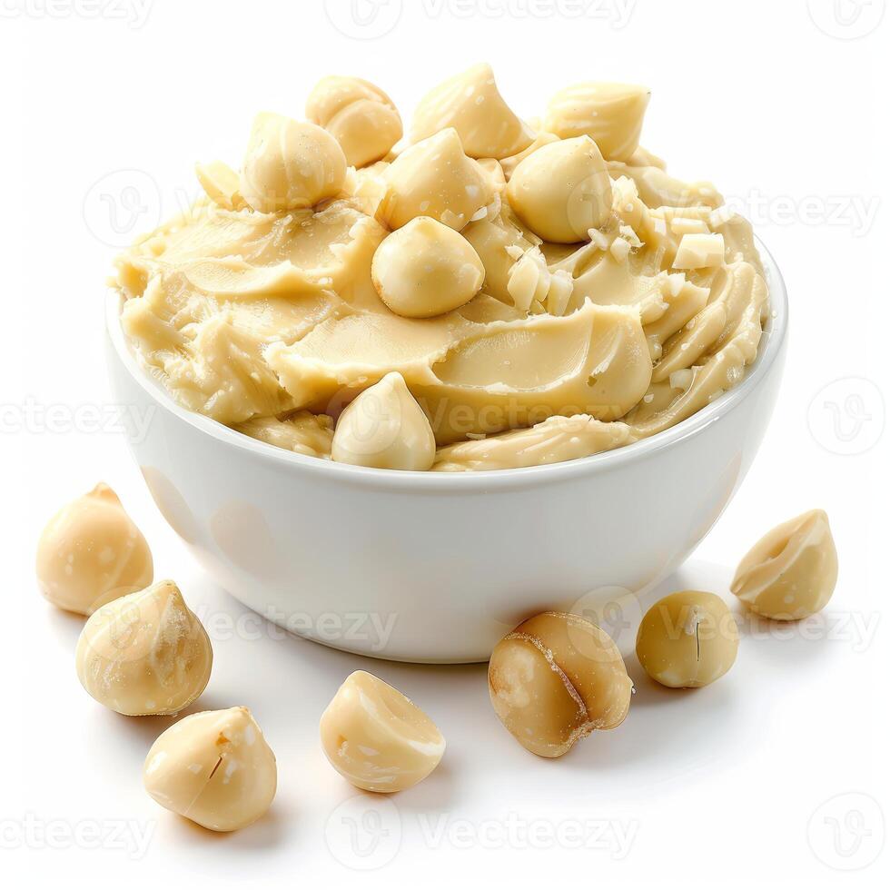 Macadamia nut butter decorated with macadamia nuts in a white bowl photo